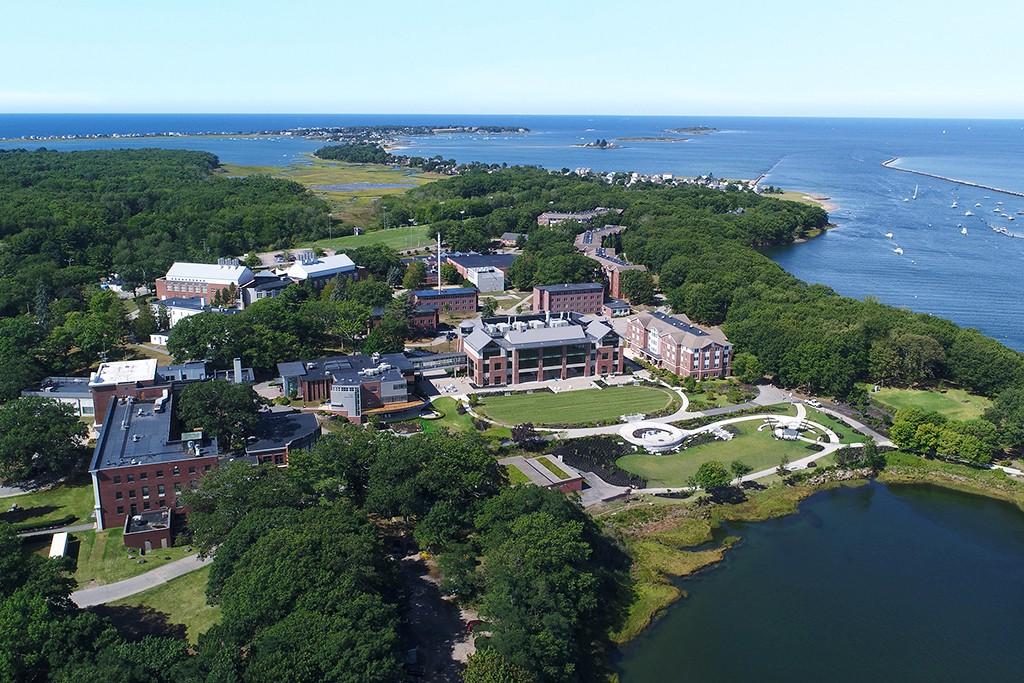 An aerial view of the Biddeford校园 near the river and ocean